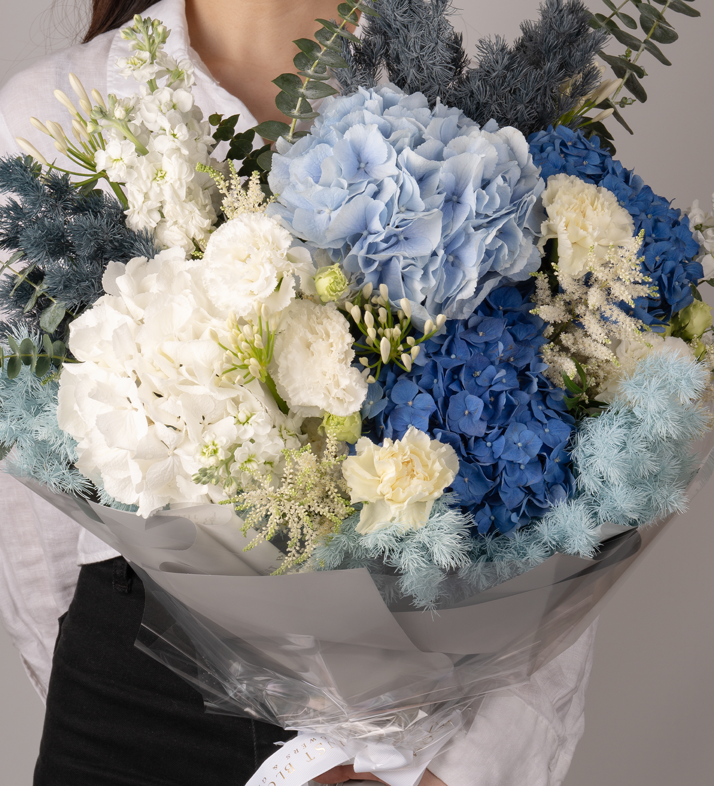 Just Bloom Stunning Fresh Flower Bouquet - Premium Dutch Hydrangeas, Stocks, Eustomas, Astibles, Asparagus Myriocladus, and Dutch Eucalyptus in Captivating Blue